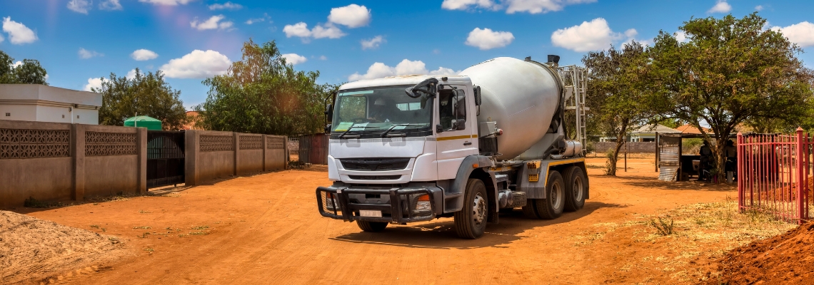 Concrete mixer truck delivering ready mix concrete for a building project in Sutton