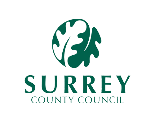 Surrey County Council logo with a green oak leaf design and text on a black background. We at Save Time Concrete, a concrete supplier, provided concrete delivery to Surrey County Council